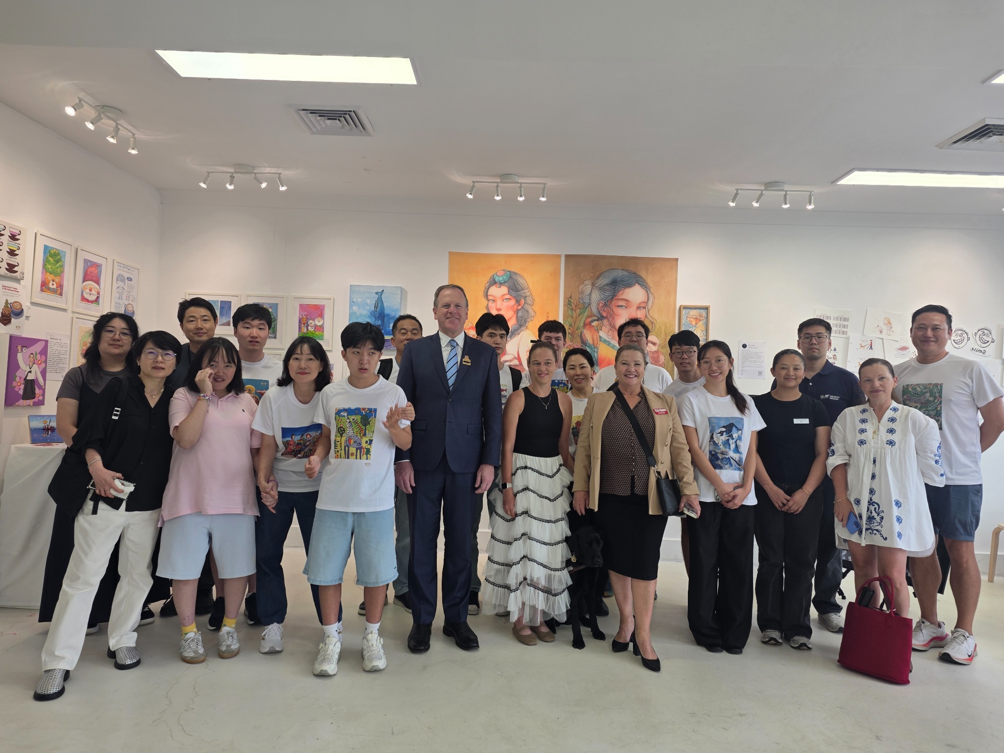 Artists and community members at an Eben Inclusive Arts Academy exhibition