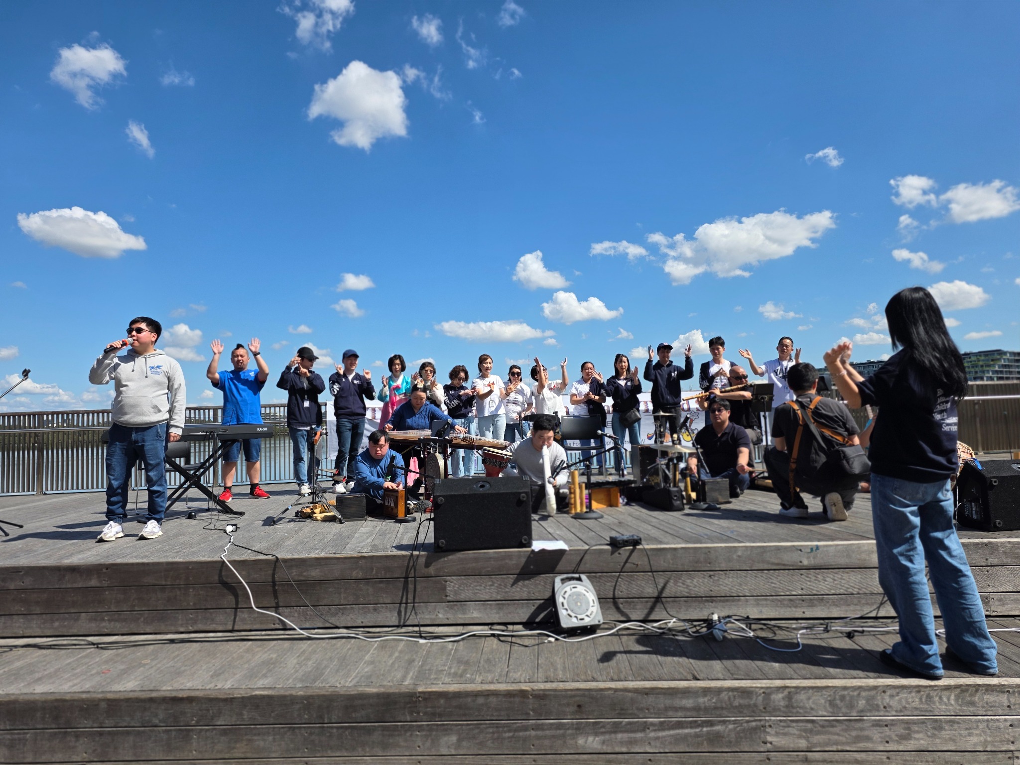Inclusive musicians and performers taking part in an outdoor community concert
